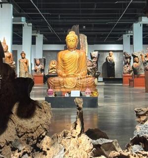 a large exhibit of statues in a museum