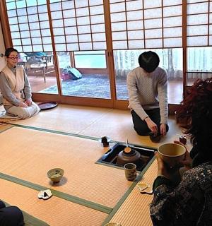 a group of people sitting on the floor in a room