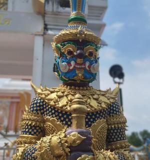 a statue of a person with a mask on it