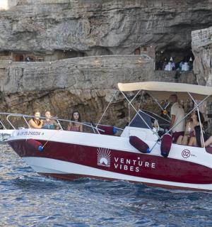 a group of people on a boat in the water