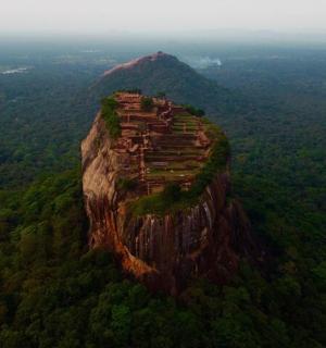 an island on top of a mountain with trees