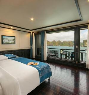 a bedroom with a large bed and a large window