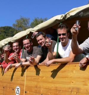 a group of people sitting in the back of a truck