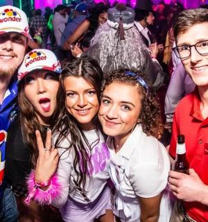 a group of people posing for a picture at a party