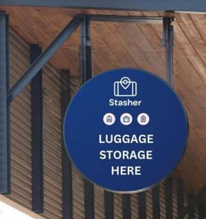 a sign hanging from the side of a building