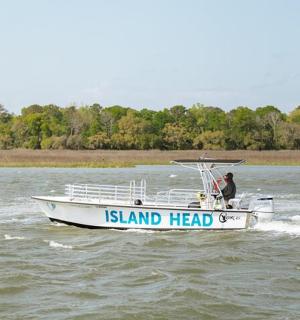 a man in a boat on the water