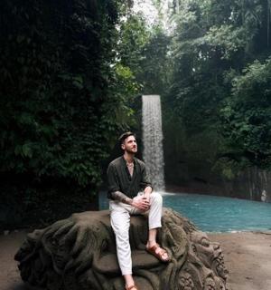 a man sitting on the back of an elephant