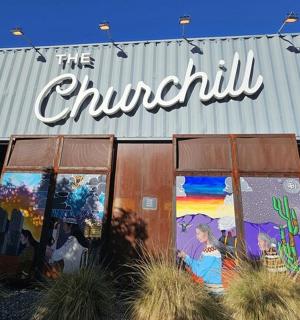 a building with paintings on the side of it