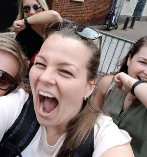a group of three girls with their mouths open