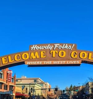 a welcome sign for a welcome to golden where the west lives