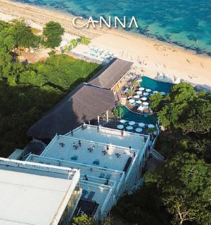 an overhead view of a building next to a beach