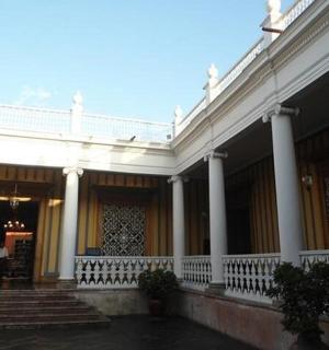 a large white building with columns and a staircase