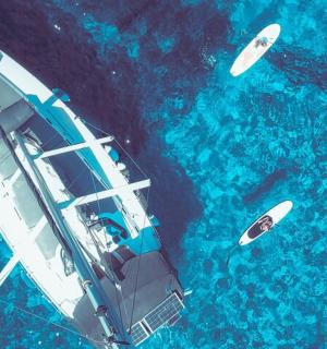 an aerial view of a boat in the water