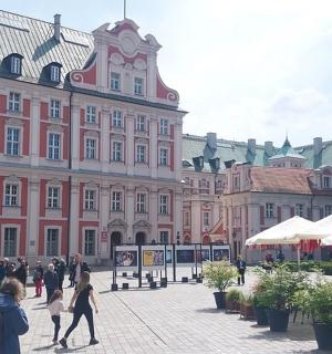 a group of people walking in front of a building