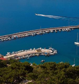 an aerial view of a marina with a dock with boats