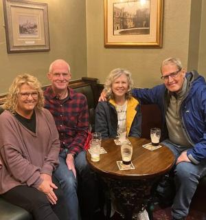 a group of people sitting around a table