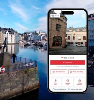 a phone taking a picture of a river with a city