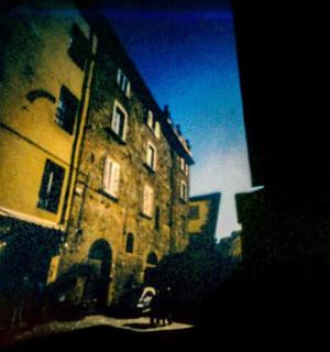 an old building on a street next to a building