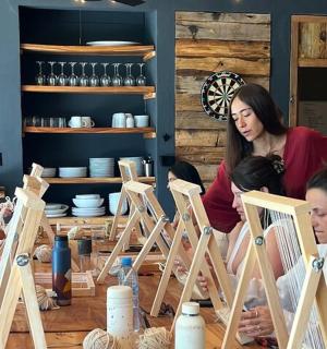 a group of people sitting around a table in a room