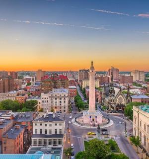 an aerial view of a city with a clock tower