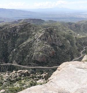 a winding road on the side of a mountain