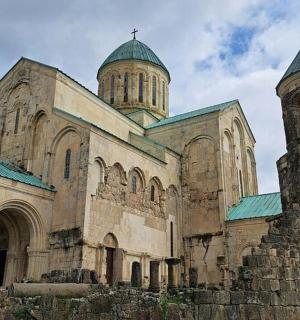 an old church with two towers on top of it