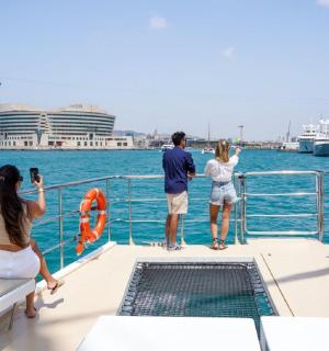 a group of people taking pictures on a boat