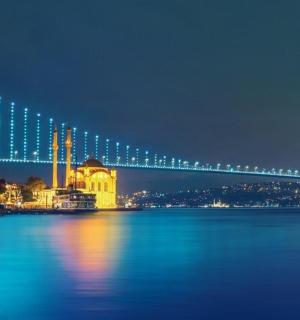 a bridge over the water at night with