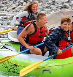 a group of people on a raft in the water