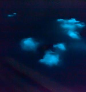 a group of clouds in the sky at night