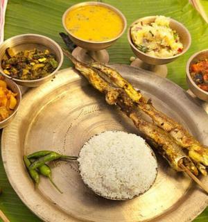 a plate of food with rice and other foods