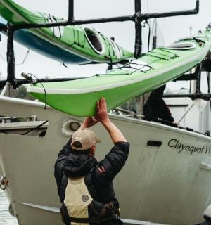 a man is on a boat in the water
