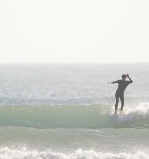 a person riding a wave on a surfboard in the ocean