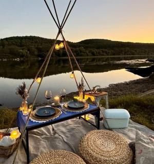 a picnic table with a view of a lake