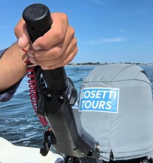 a man is holding a life vest on a boat