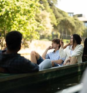 a group of people sitting on a bench