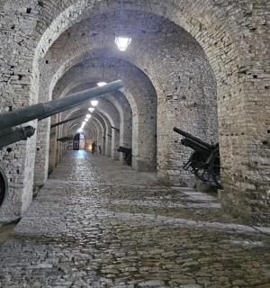 an alley way in an old stone building