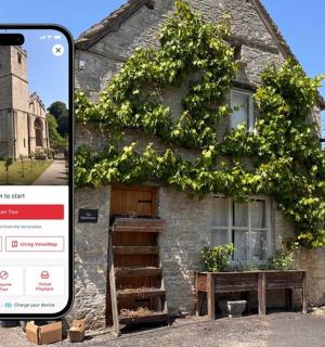 an iphone screenshot of an old house with a tree