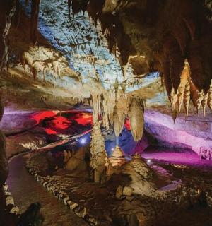 a cave with icicles hanging from the ceilings