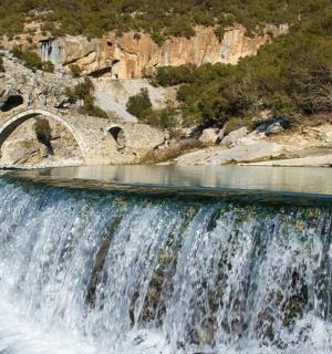 a waterfall in the middle of a river
