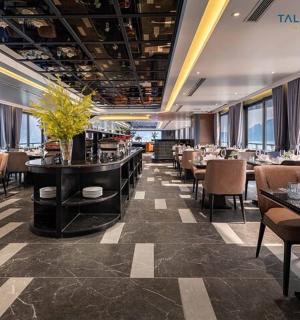 a dining room with tables and chairs in a restaurant