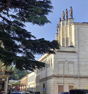 a large building with a clock on the side of it