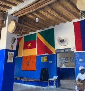 two people sitting in a room with colorful walls