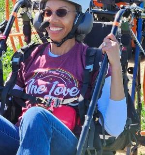 a woman sitting in a chair with headphones on