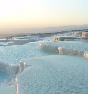 a group of large pools of blue water