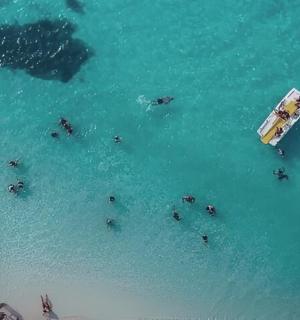 a group of people in the water on a boat