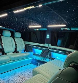 an inside view of a limousine with blue lights