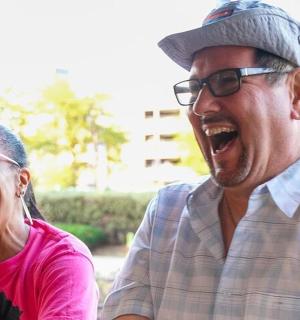 a man and a woman talking on a cell phone