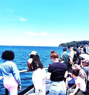 a group of people on a boat in the water