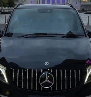 a black car parked in a parking lot